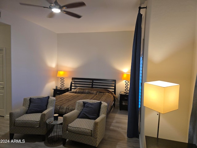 bedroom featuring wood-type flooring and ceiling fan