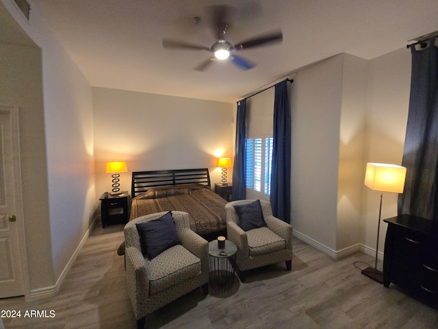 bedroom with ceiling fan and light wood-type flooring