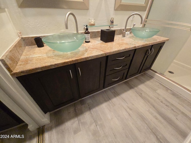 bathroom featuring vanity and hardwood / wood-style flooring