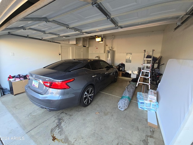 garage featuring gas water heater and a garage door opener