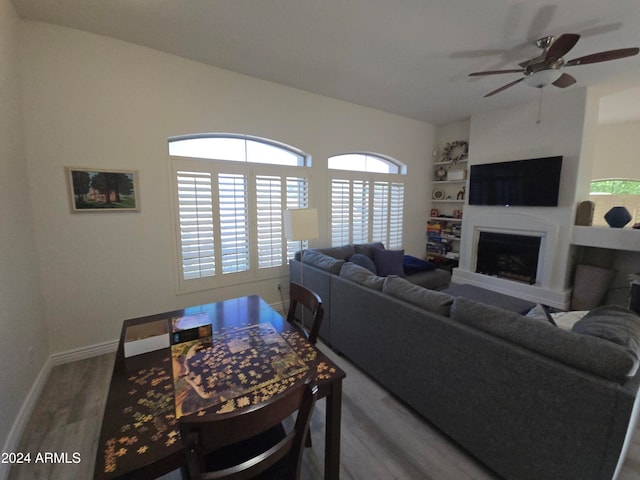 living room with hardwood / wood-style flooring and ceiling fan