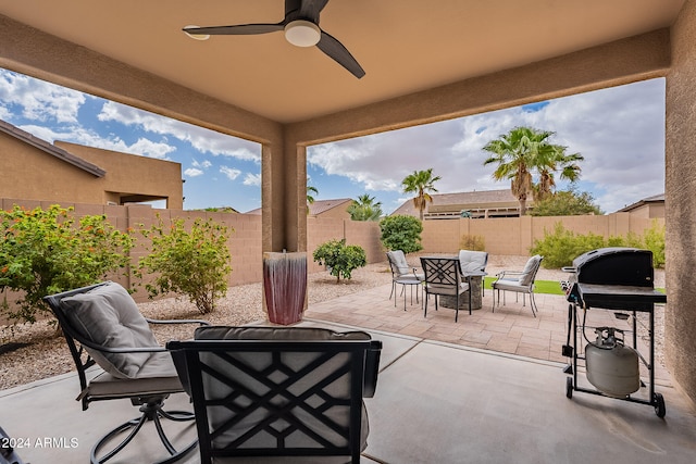 view of patio with grilling area and ceiling fan