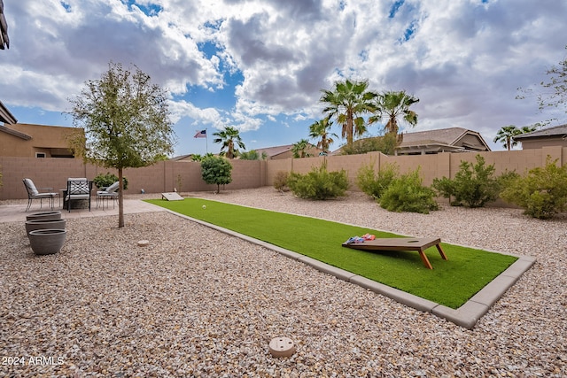 view of yard with a patio and a fire pit