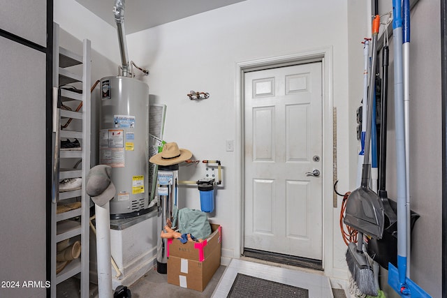 utility room featuring water heater