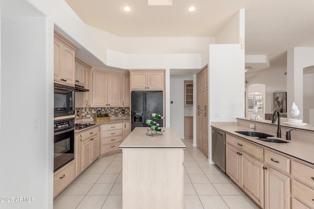 kitchen featuring a kitchen island, a sink, black appliances, and light brown cabinets