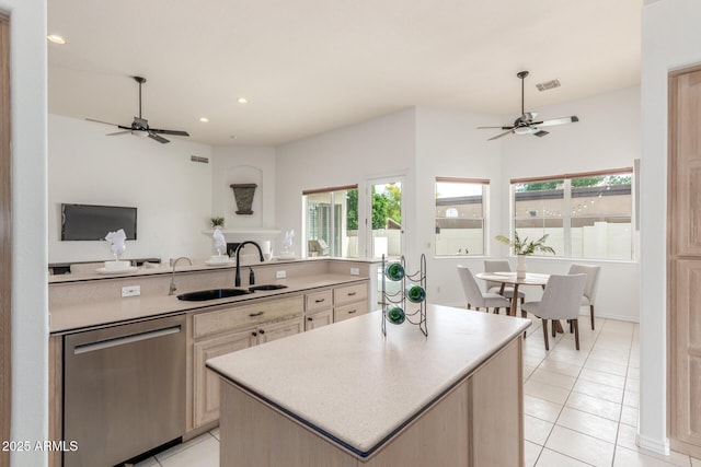 kitchen featuring ceiling fan, a wealth of natural light, a sink, and dishwasher