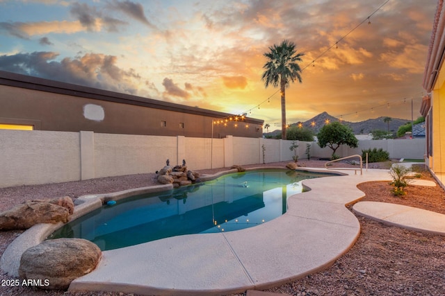view of pool featuring a fenced backyard, a fenced in pool, and a patio