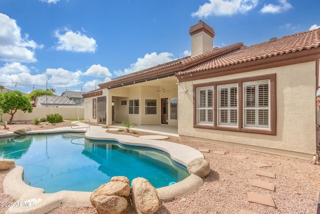 view of swimming pool featuring a fenced in pool, a ceiling fan, fence private yard, and a patio area