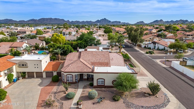 bird's eye view featuring a residential view and a mountain view