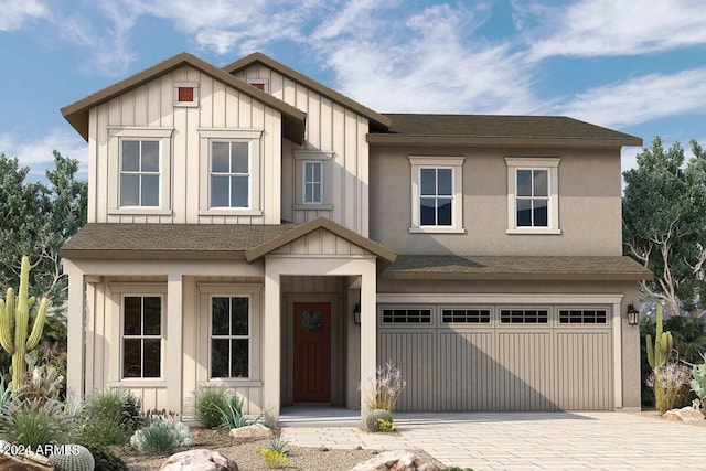 view of front of home with an attached garage, a shingled roof, decorative driveway, and board and batten siding