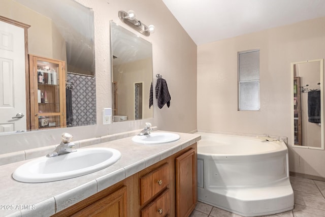 bathroom featuring vanity, separate shower and tub, and tile patterned floors