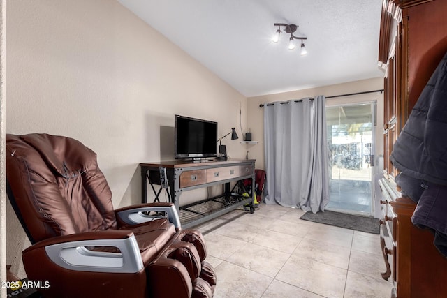 tiled living room with lofted ceiling