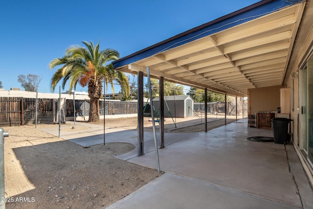 view of patio / terrace featuring a shed