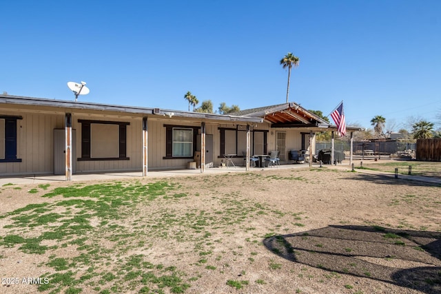 rear view of house featuring a patio