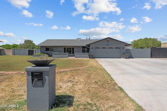 4602 W Monte Cristo Ave, Glendale, AZ 85306 - ranch-style house featuring a garage, driveway, and stucco siding