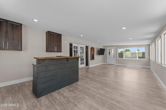 4602 W Monte Cristo Ave, Glendale, AZ 85306 - unfurnished living room with light wood-type flooring, recessed lighting, baseboards, and french doors