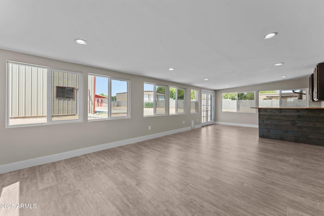 4602 W Monte Cristo Ave, Glendale, AZ 85306 - unfurnished living room with light wood-style flooring, recessed lighting, and baseboards
