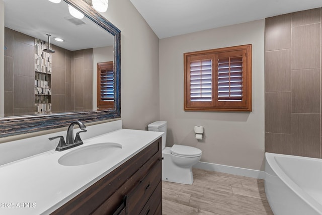 4602 W Monte Cristo Ave, Glendale, AZ 85306 - bathroom with vanity, baseboards, and toilet