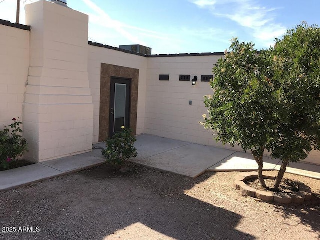 2534 N 52nd St, Phoenix, AZ 85008 - view of side of home featuring an attached garage and concrete block siding