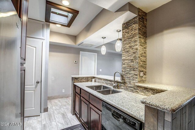 2534 N 52nd St, Phoenix, AZ 85008 - kitchen with dishwasher, a sink, light stone countertops, a peninsula, and hanging light fixtures