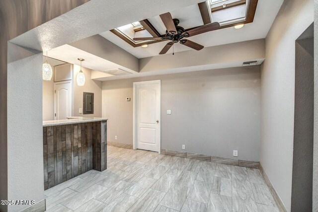 2534 N 52nd St, Phoenix, AZ 85008 - empty room featuring electric panel, ceiling fan, a tray ceiling, baseboards, and visible vents