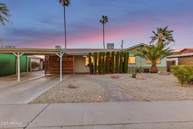 6932 E Latham St, Scottsdale, AZ 85257 - ranch-style house featuring concrete driveway and a carport