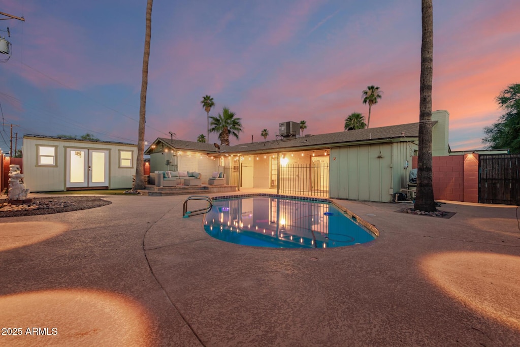 6932 E Latham St, Scottsdale, AZ 85257 - view of pool with a patio, french doors, an outdoor structure, and an exterior structure
