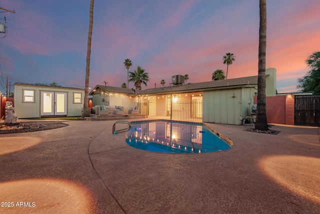 6932 E Latham St, Scottsdale, AZ 85257 - view of pool with a patio, french doors, an outdoor structure, and an exterior structure
