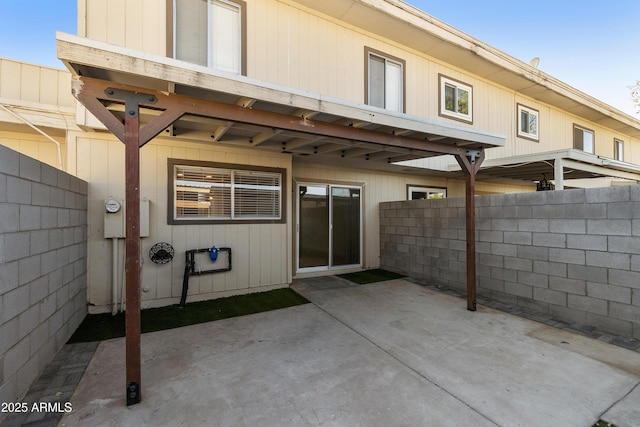 back of house featuring fence and a patio area