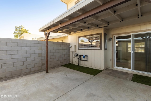view of patio / terrace featuring fence