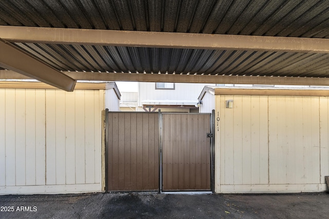 view of gate with fence