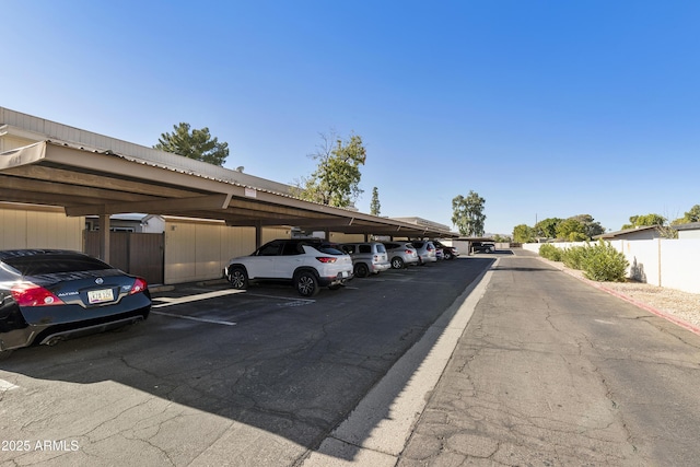 covered parking lot with fence