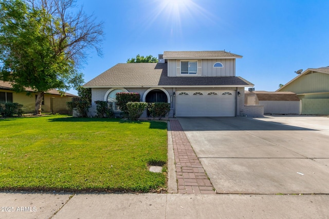 view of front of home with a garage and a front lawn