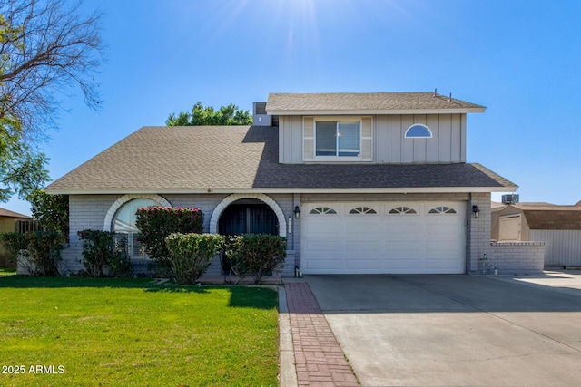 view of front of home with a garage and a front lawn