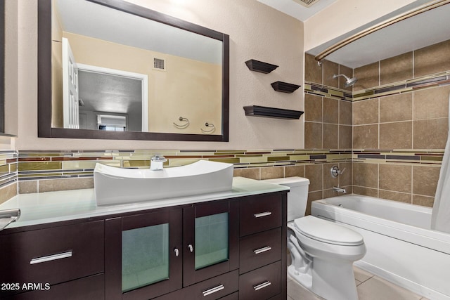 full bathroom with toilet, tasteful backsplash, shower / tub combo with curtain, tile walls, and vanity