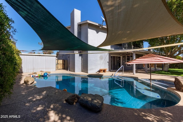 view of swimming pool with a patio