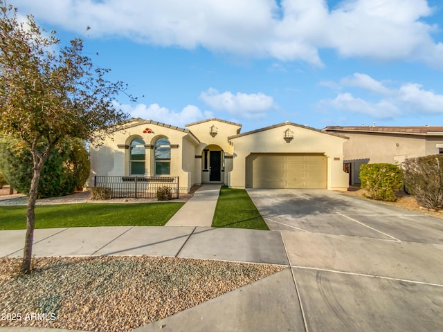 mediterranean / spanish-style home featuring a garage