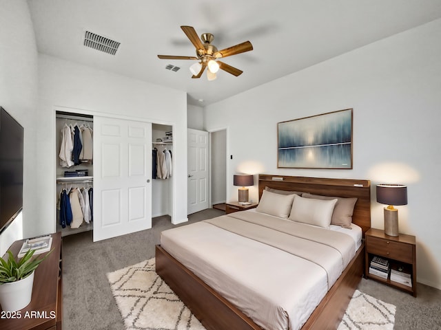 carpeted bedroom with ceiling fan and a closet