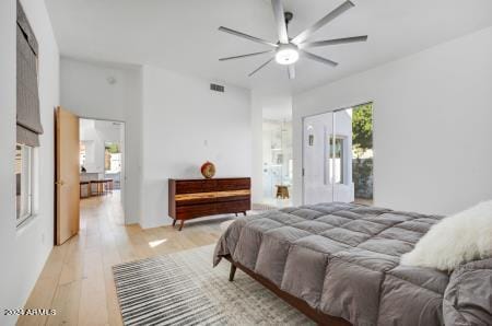 bedroom with ceiling fan and light hardwood / wood-style floors