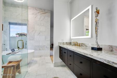 bathroom with vanity and a bathing tub