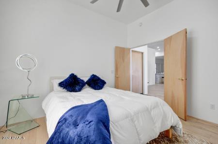 bedroom featuring light hardwood / wood-style flooring and ceiling fan