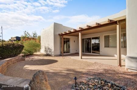 back of house with a patio area