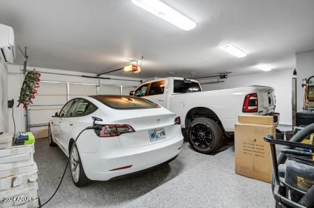 garage featuring an AC wall unit