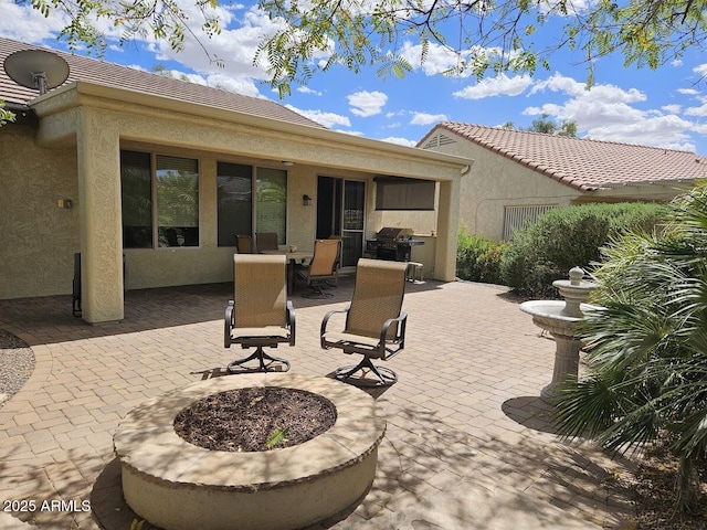 view of patio featuring a grill