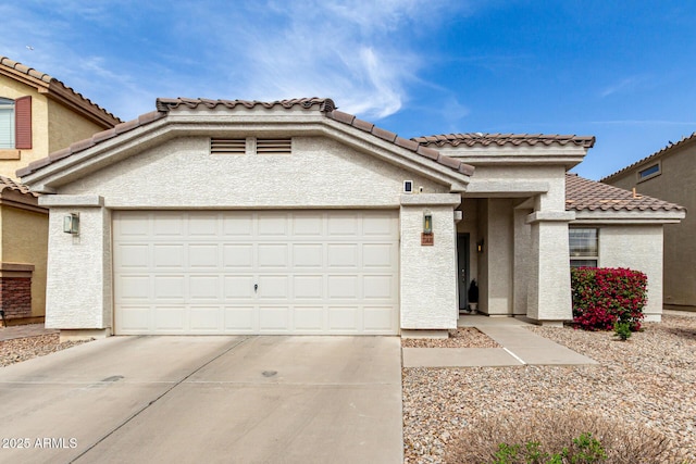 view of front of home with an attached garage and stucco siding