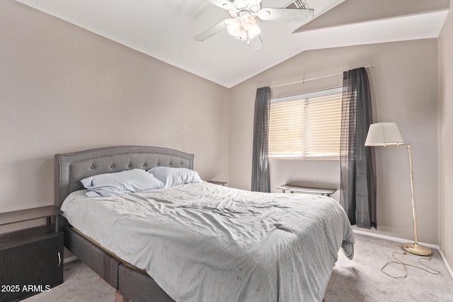 carpeted bedroom featuring vaulted ceiling, baseboards, and ceiling fan