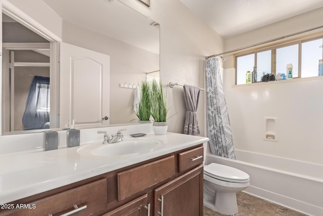 bathroom featuring toilet, vanity, and shower / bathtub combination with curtain