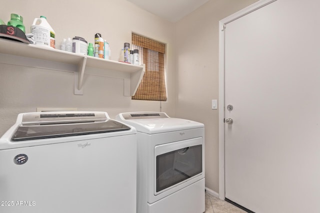 laundry room with light tile patterned flooring, laundry area, and separate washer and dryer