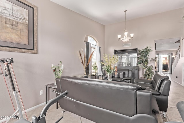 living area featuring a chandelier, visible vents, baseboards, and light tile patterned flooring