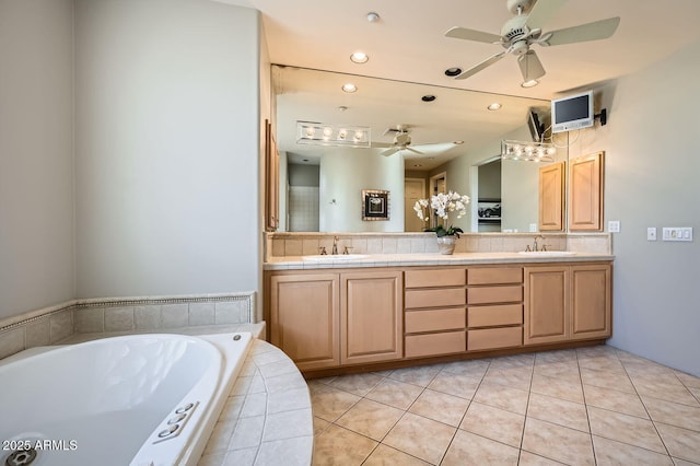 bathroom featuring tile patterned flooring, vanity, ceiling fan, and tiled bath